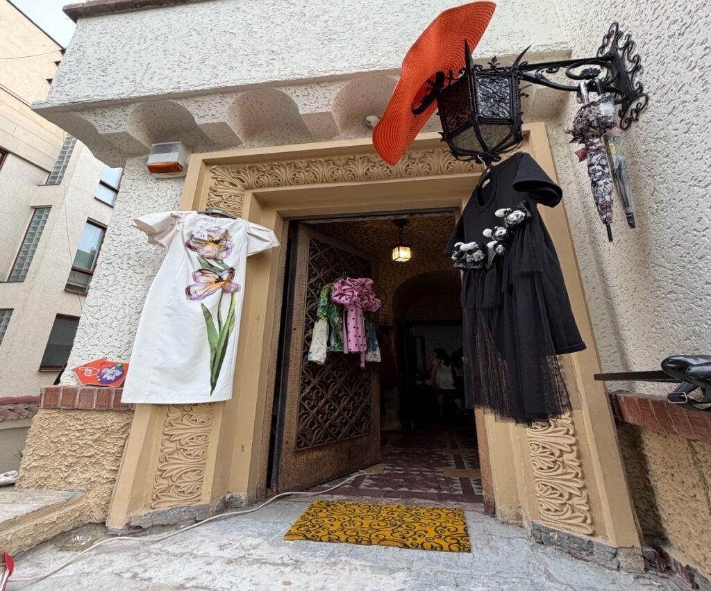 A door with a black robe and a white towel from it AI-generated content may be incorrect.