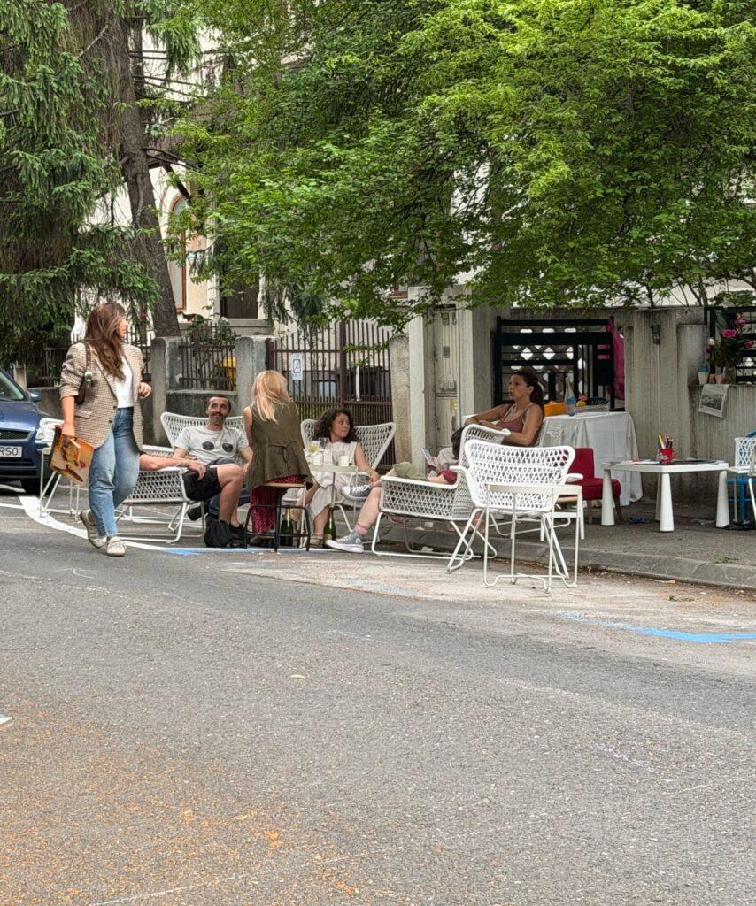A group of people sitting outside AI-generated content may be incorrect.