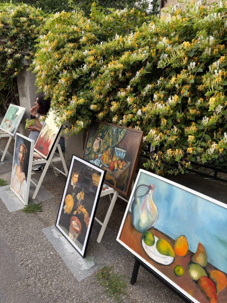 A person painting on easels AI-generated content may be incorrect.