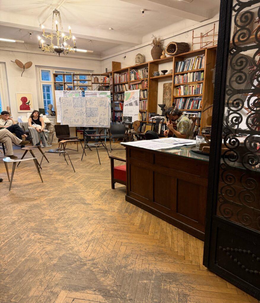 A room with a large table and bookshelves AI-generated content may be incorrect.