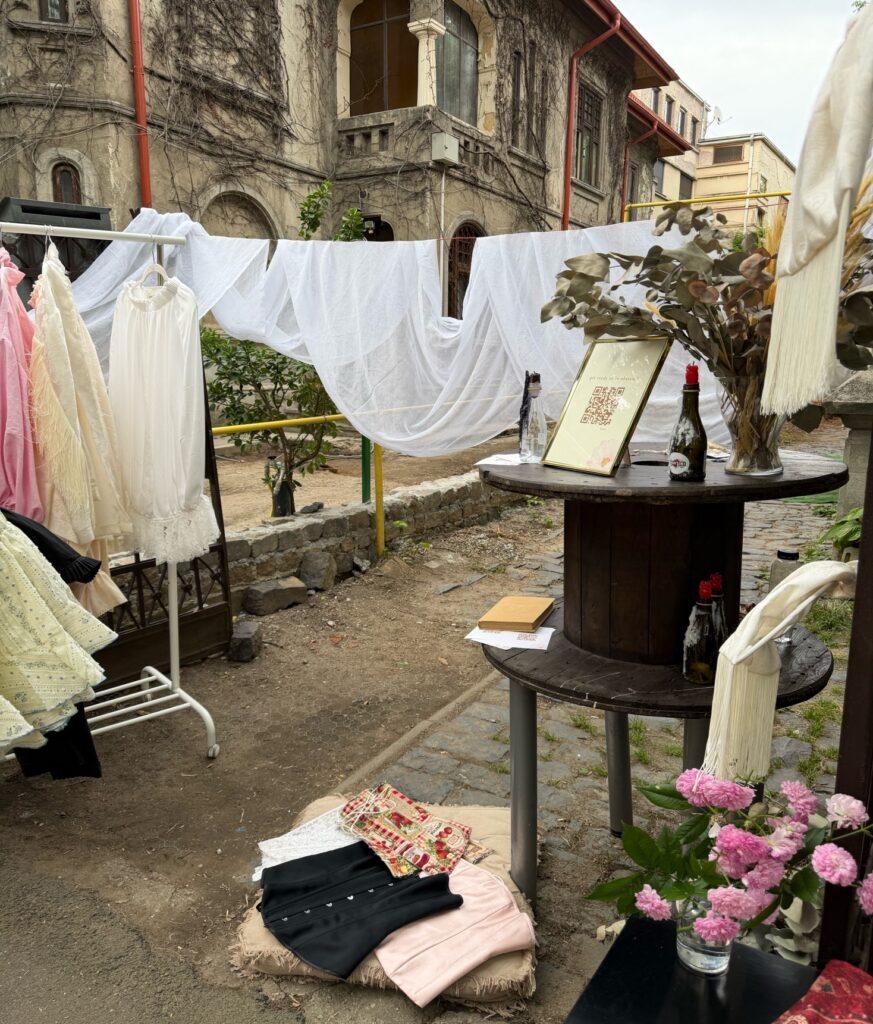 A table with flowers and clothes on it AI-generated content may be incorrect.