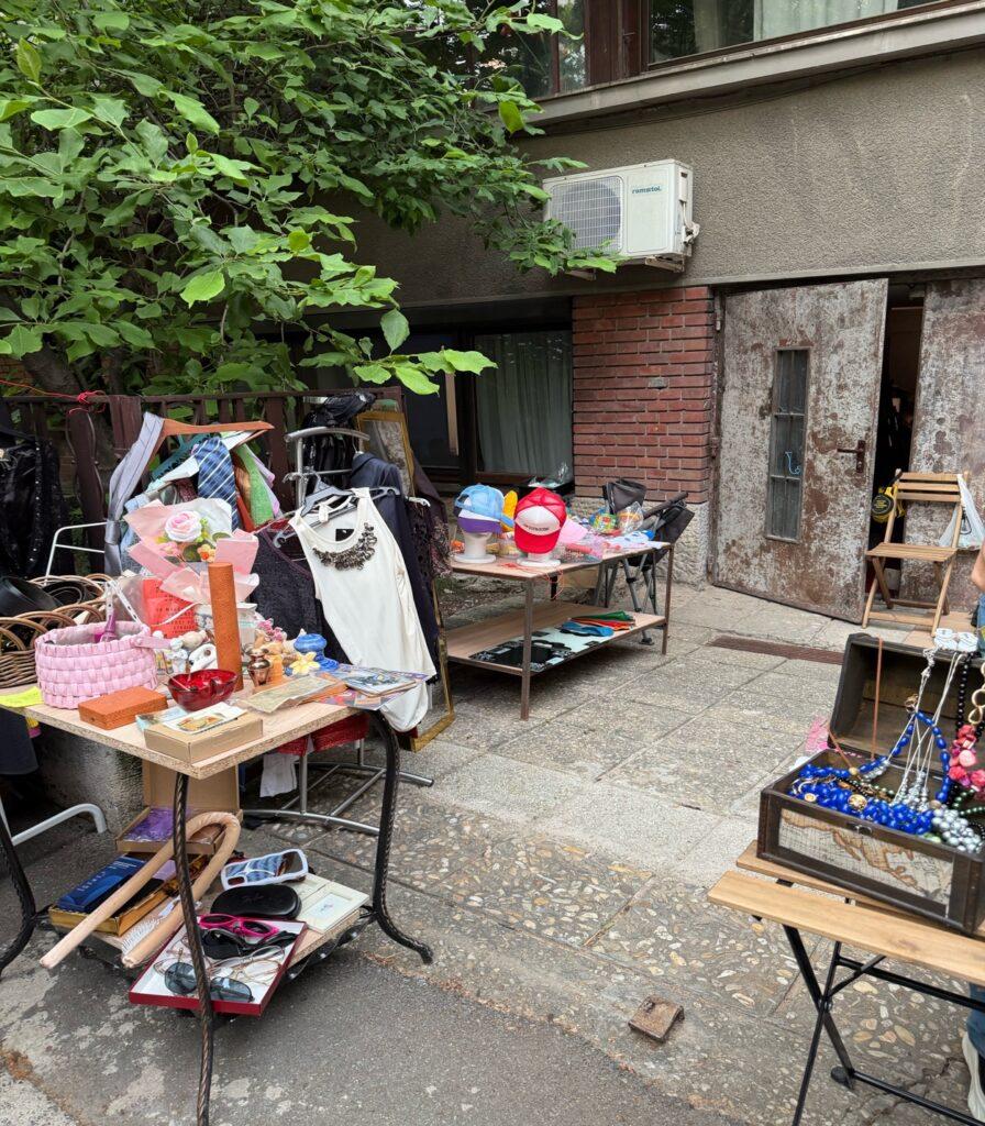 A yard with a table of items and a tree AI-generated content may be incorrect.