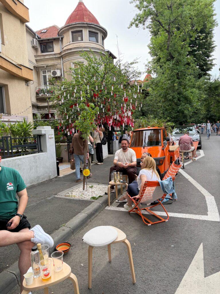 People sitting on the sidewalk AI-generated content may be incorrect.
